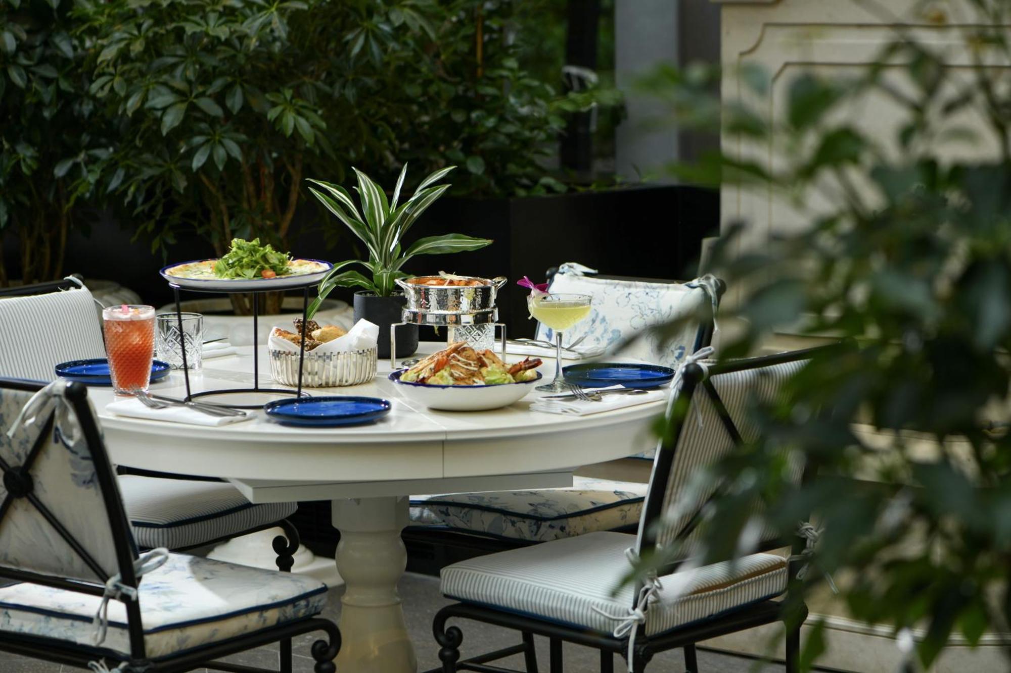 Banyan Tree Doha At La Cigale Mushaireb Екстер'єр фото A table set for afternoon tea at the Mandarin Oriental, Paris